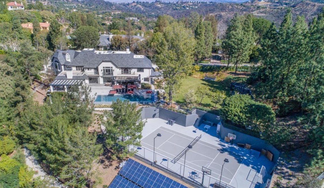 Bieber View of house pool and tennis court and it is solar powered