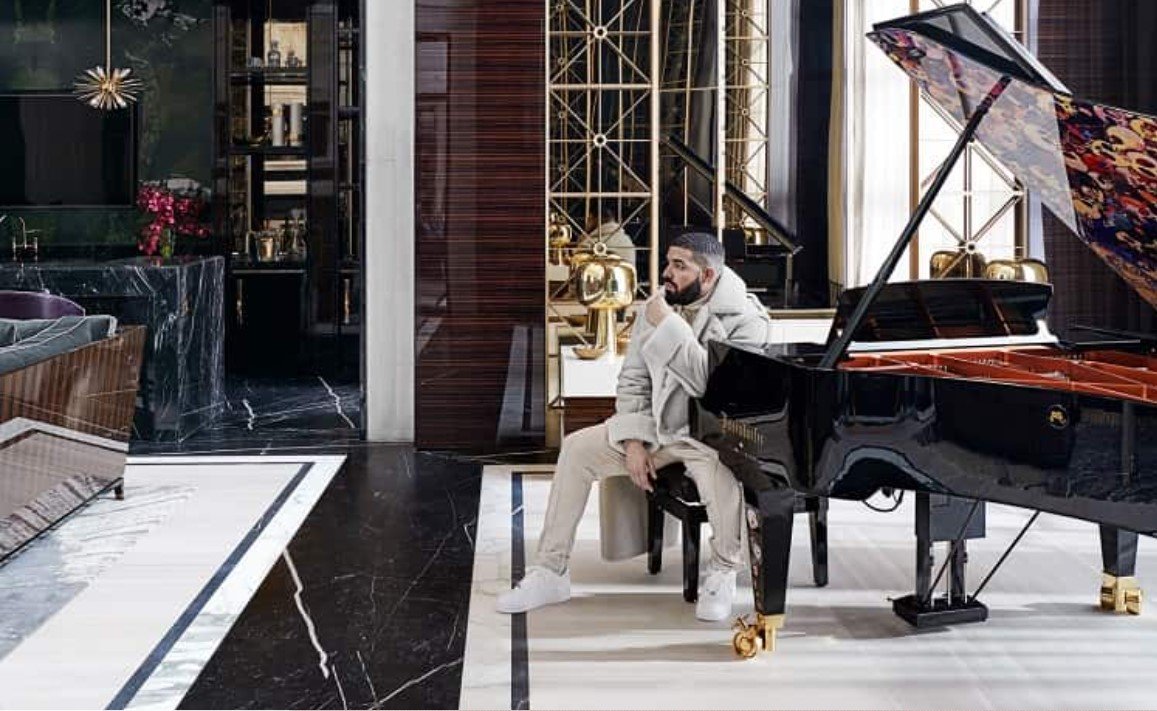 Drake sitting by grand piano Ferrris Raf