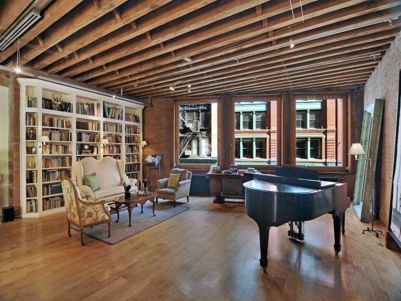 TSwift Tribeca Piano end of large room with big bookcaselibrary Observer